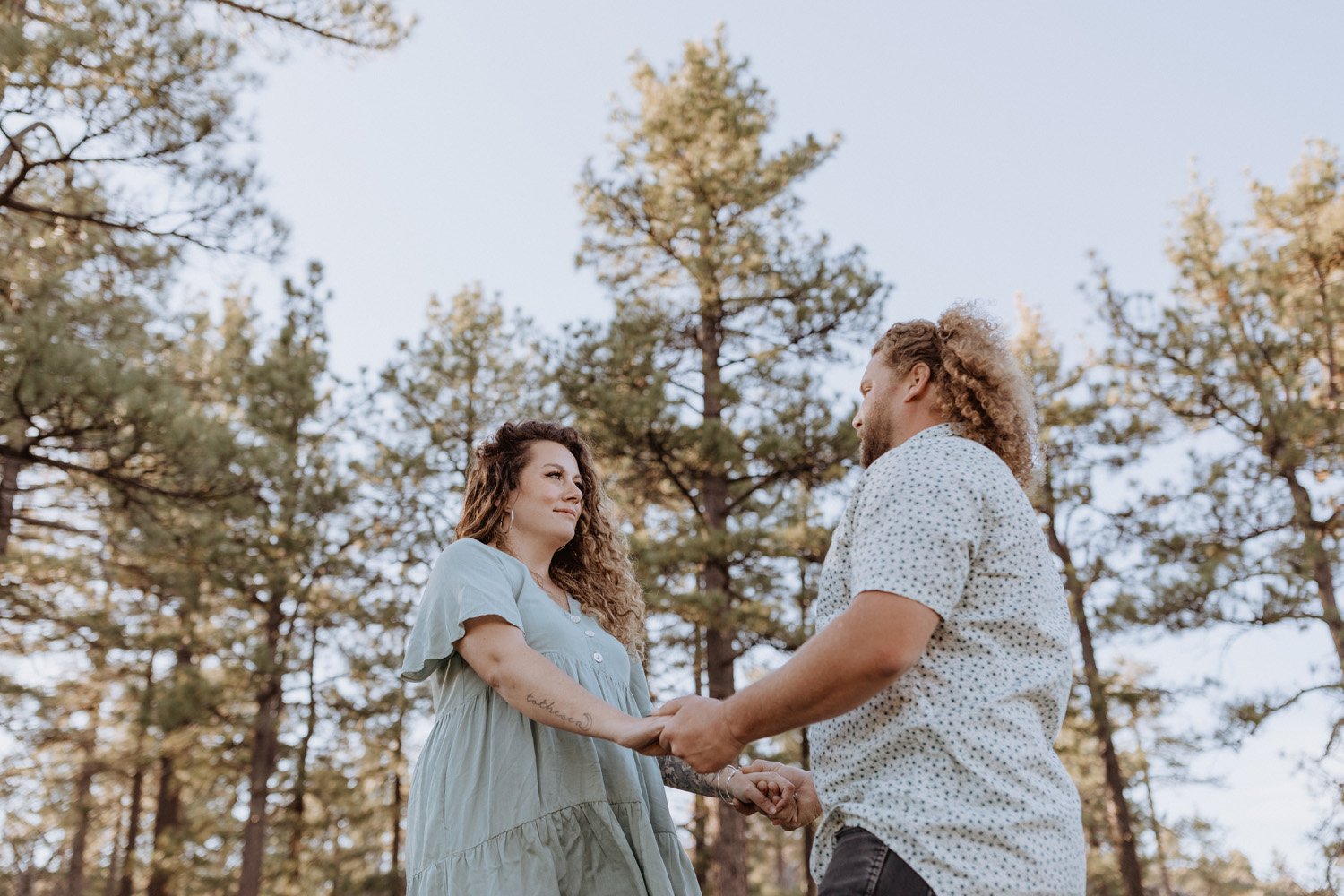 Couple holding hands at their Mt Laguna engagement session.